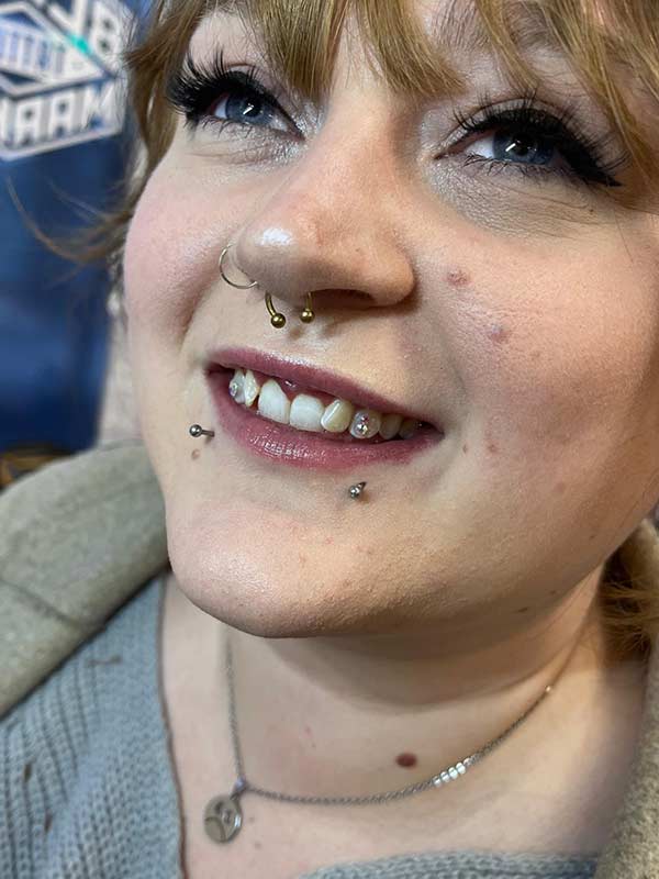 A client with Charmed Smile tooth gems